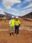Engineers stand in front of large solar plant at Binduli Mine, Western Australia